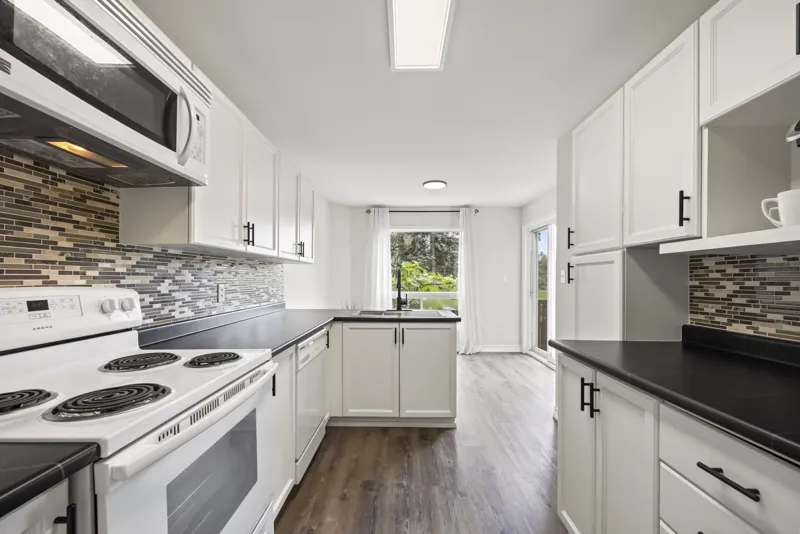 White kitchen with tile backsplash